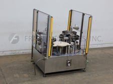 Filamatic #MNB-2000, Monoblock filler, tipper and capper, 20-60 containers per minute, 2-head piston filler