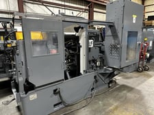 Wickman, 6 spindle, 1" capacity, electromagnetic chuck, motor & controls, stock stand & reel, chip conveyor