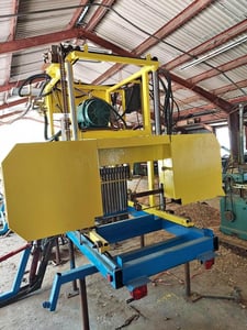 Logmaster #LM5 Sawmill, 2" blades, 36" max log diameter, hydraulic log loader, turner, log tapers, 75 HP