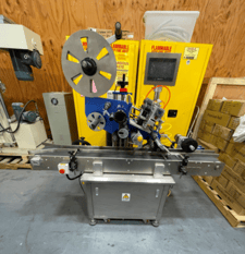 Model TT-LB, wipe-on labeler with horizontal pass thru belt conveyor through labeling station