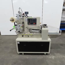 Excel #C-450H, horizontal flow wrapper, 220 V., with Sojet Inkjet printer