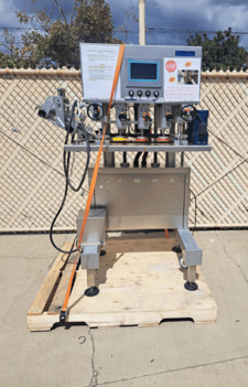 TotalPack #DS-200A, automatic inline capper, 6 spindles, 150 bottles/minute