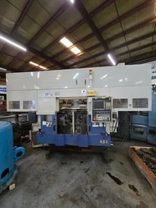Muratec #MW-120, twin spindle turning center w/stacker loader single gantry, chip conveyor, 2011