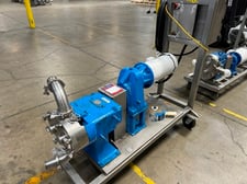 Waukesha #60, positive displacement pump, set up with top feed & bottom discharge including 2-1/2" dia.