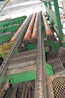 58' 2-Strand 81X chain transfer with 23' jump rolls, for lumber banding/packaging