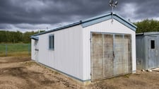 32' Kearney & Trecker Metal Industries, steel/concrete storage building, assembled on concrete pad, 2002