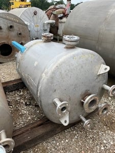 Vertical Stainless Steel tank, dished top & bottom, mounted on legs