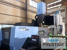 Daewoo Doosan #BM1530M, bridge type vertical machining center, 118" X, 59" Y, 67" B/C, Fanuc 31iB, 40