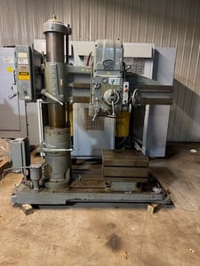 4' -11" Carlton Radial Drill, power elevation, 30" x 48" L shaped table, coolant in base