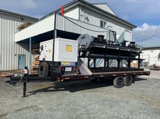 Andgar, custom built hemo bucker, 84 ports, includes conveyor & operator stand attachments