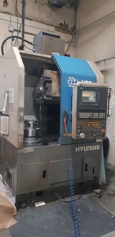 Hyundai #HiT-V3, CNC vertical turret lathe, 24.4" swing, 12" chuck, 30-3000 RPM, A2-8, Siemens Sinumerik, 2001
