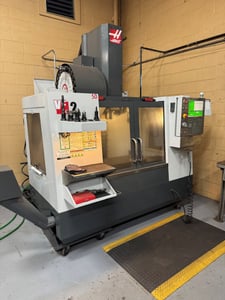 Haas #VF-2, with TR-160 5th Axis, Renishaw probe, programmable coolant, 24 automatic tool changer, 1192 cut