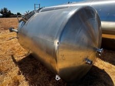 1500 gallon Cherry Burrell, Stainless steel vertical tank, dish top & bottom, bottom center drain