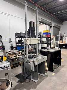 55 KIP (250kN) MTS #322.31, fatique teating load frame with T-slotted base table, 2 columns