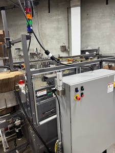 Pearson Packaging Systems, complete packaging system, made up of box erector, robot, palletizer & unscrambler