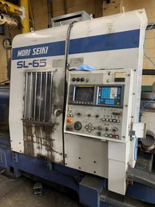 Mori Seiki #SL-65B, CNC lathe, 35" swing, 24" chuck, 4.7" bar, 32.2" diameter, 31.1" length, A2-11, 12