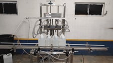 Neumann Packaging #SO1A, Semi-automatic Overflow Bottle Filling Machine, 4-Head, 1" diameter Nozzles, 2022
