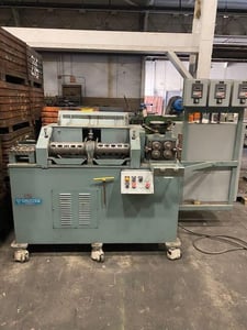 Shuster #24SFT, twin arbor wire straightener, 25-200 FPM, twin counter rotating arbors, 4 exit rolls, 2004