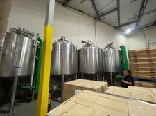 2500 gallon DCI, 316L Stainless Steel tank, jacketed & insulated, top entering agitation, 5 HP, 140 psi