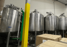 2500 gallon DCI, 316L Stainless Steel tank, jacketed & insulated, top entering agitation, 5 HP, 140 psi