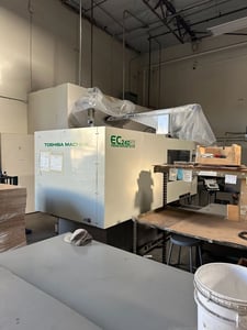 243 Ton, 15.4 oz., Toshiba #EC240NIIV30-8B, horizontal plastic injection molder, 24.02" x 22.05" tie bar