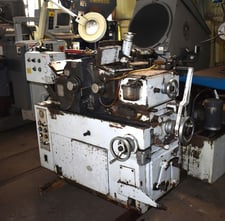 Unison No. U12, high production centerless grinder, thru feed workrest, coolant system, hydraulic regulating