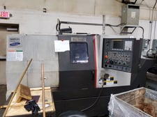 Samsung #SL-15E, cnc lathe, 17.7" swing, 1.8" bar, 25 HP, 6 RPM, 6" chuck, 11.8" diameter x 20.5" L max,
