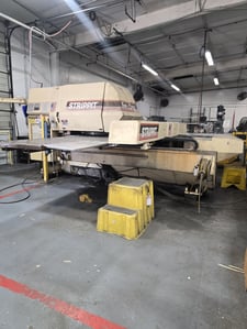 33 Ton, Strippit FC-1250-SL, GE Fanuc, 1993 Still under power for inspection, work piece 50" x 80