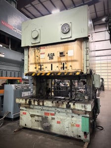 275 Ton, Aida #NC2-250(2), double crank gap frame OBI Press, 11" stroke, 14-27 SPM, 4.7" adj, 86.2" between