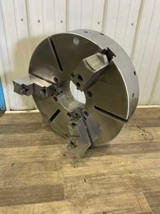 23.6" Pratt Burnerd, 3-jaw manual chuck, 6-3/4" thru hole, removable top jaws