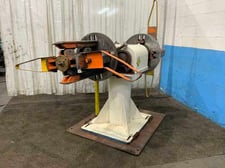 10000 lb. RLM, double end uncoiler, 20" width, 60" outside dimensions, manual expansion, adjustable base, 2002