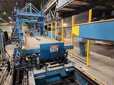 10000 lb. Stamco banding line, 72" OD, includes 4-arm turnstile, pick-n-place downlayer conveyor