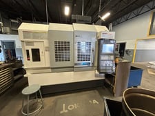 Okuma #M560-V, vertical machining center, 41.3" X, 22" Y, 18.1" Z, 30 HP, 32 tool, 4th Axis, Probe, 1000 psi