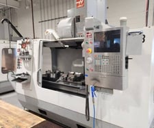 Haas #VF-4B, vertical machining center, 50" X, 20" Y, 25" Z, 10000 RPM, 20 HP, 52" x 18" table, 30 automatic