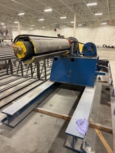 20000 lb. McKay, uncoiler, 22" ID, 84" outside dimensions, 67" width, 4 leaf mandrel, powered