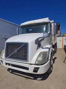 Volvo #VNL, Tri-axle Dump Truck, day cab, D13, 652,867 mi, 2012