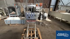 Capacity Retorquer, 2 quil sets, side belts, over conveyor