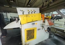 15000 lb. Dallas #51855, servo feedline, 36" x .125" stock, 60" OD, 18"-22" ID, hold down arm, 7-roll