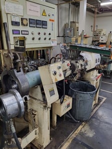 90" MM cold feed 3-1/2" Mitsuba #90G, 12:1 L/D rubber extruder with puller and automatic cut to length cutter