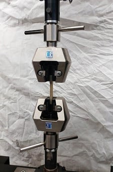 22500 lbf. (100kN) Force capacity wedge action tensile grips, new