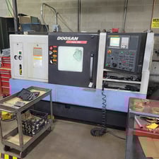 Daewoo Doosan #Lynx-300, Fanuc Control, 2-Axis, 25.6" swing, 10" chuck, 3" bar, Hennig chip conveyor, 2012