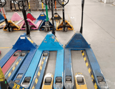 Pallet jacks, 5500 lbs hydraulic skids of different brands distributed throughout the plant