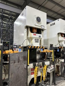 220 Ton, Aida #NC1-2000(2), single crank gap frame press, 9.84" stroke, 17.72" Shut Height, 4.33" ram adj.