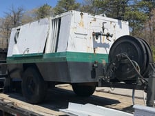 185 cfm, John Deere, Towable Rotary Screw Air Compressor, (2) jackhammers, 300 lb. sandblast pot, hose reel