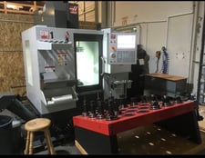 Haas #DM-1, vertical machining center, 20" X, 16" Y, 15.5" Z, 15000 RPM, 15 HP, 18 automatic tool changer