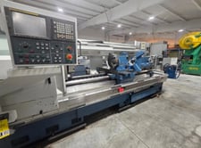 33" x 90" Romi #M33, oil field hollow spindle CNC lathe, Fanuc 21i, 24" chuck, 10" bar, 23" turning diameter