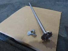 1" diameter x 34.5" long stainless, (2) 4" saw tooth blades, mounting coupling, 3" boat prop blade, D-cut