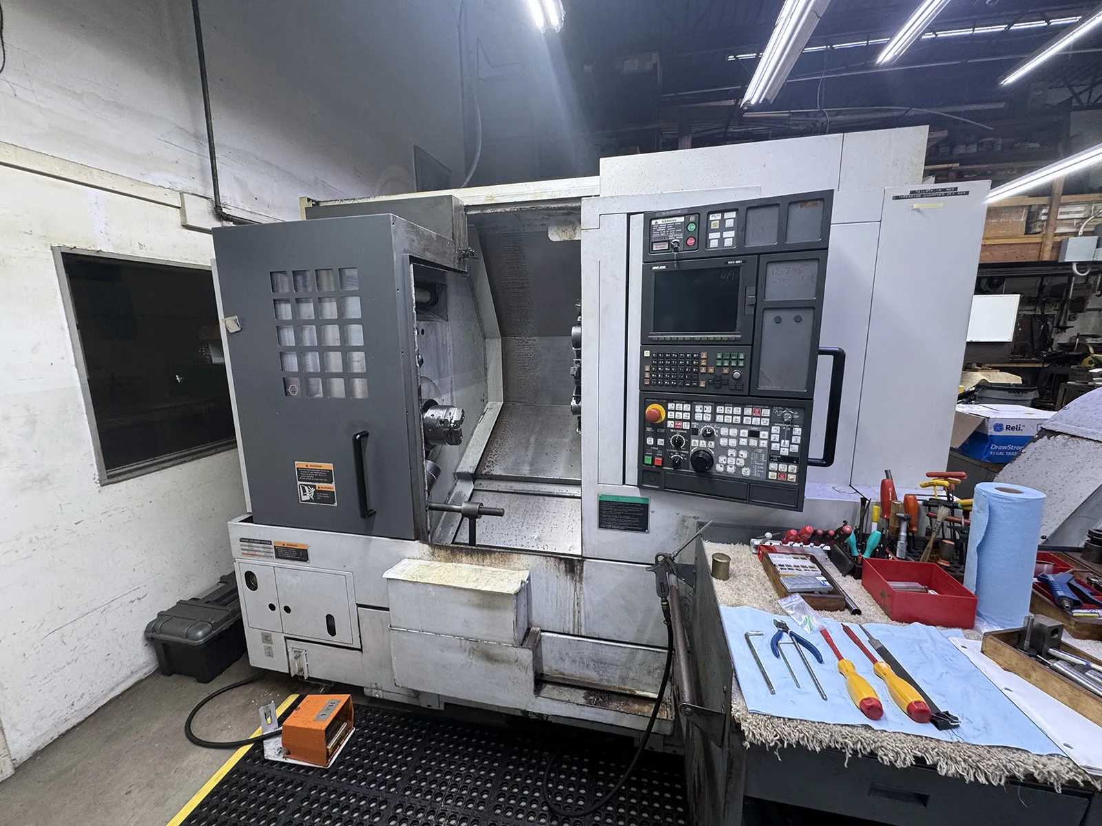 Mori Seiki #NL-1500/500, CNC lathe, 36.4" swing, 14" dia., 20.2" lgth, 6" chuck, 2" bar, 15 HP, 6000 RPM, 12