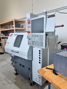 Haas #CL-1, CNC lathe, 11" swing, 5" diameter, 4" chuck, 1" bar, 5 HP, 6000 RPM, 8 tool, 6' bar feeder, live