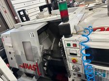 Haas #SL-20T, CNC lathe, 23" swing, 24" machining length, 8" chuck, 2" bar, 20 HP, 4,000 RPM, tailstock, 1999